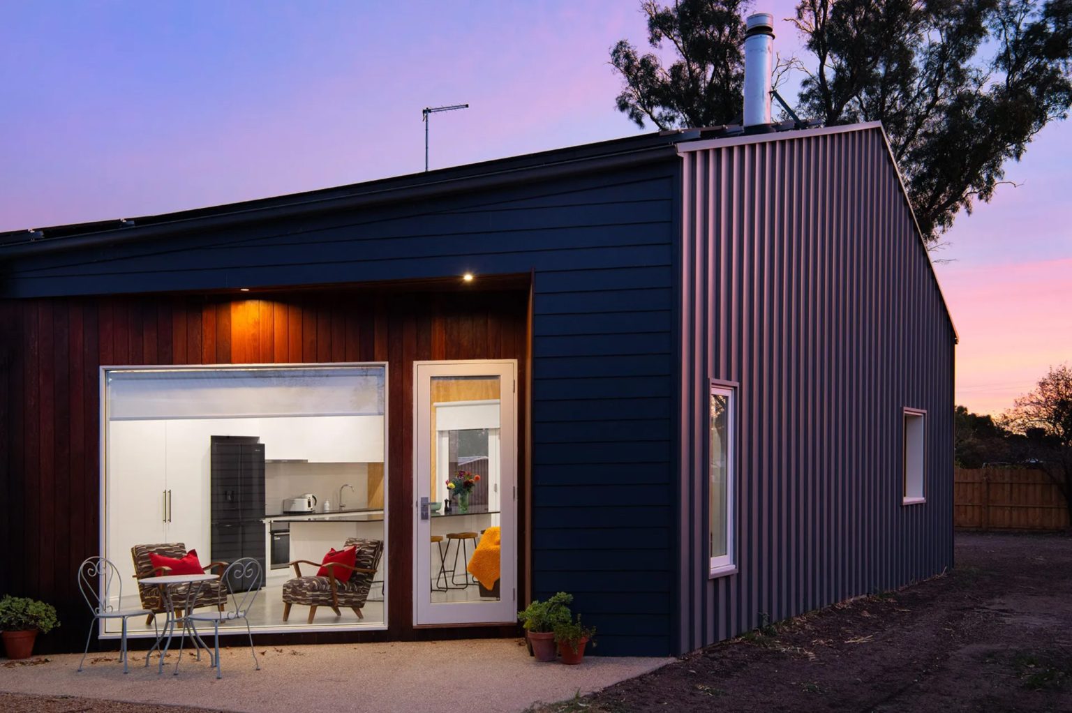 Modern minimalist house exterior at sunset