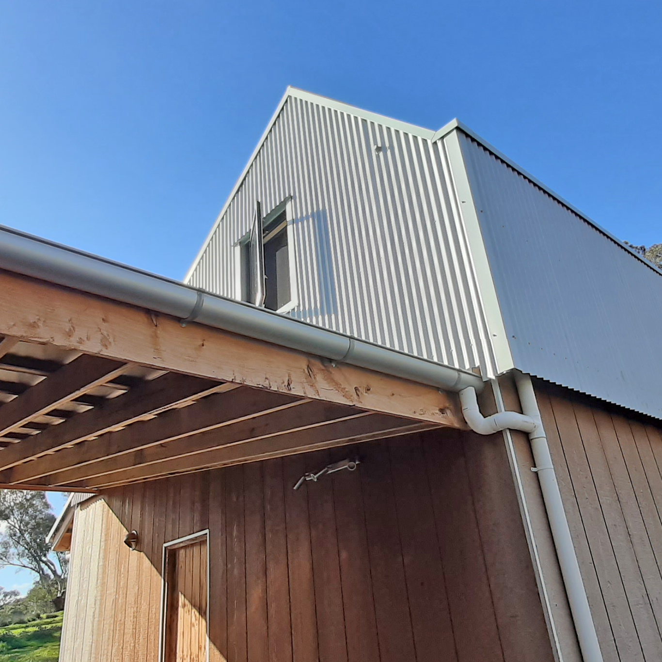 Modern barn-style house with corrugated iron roof
