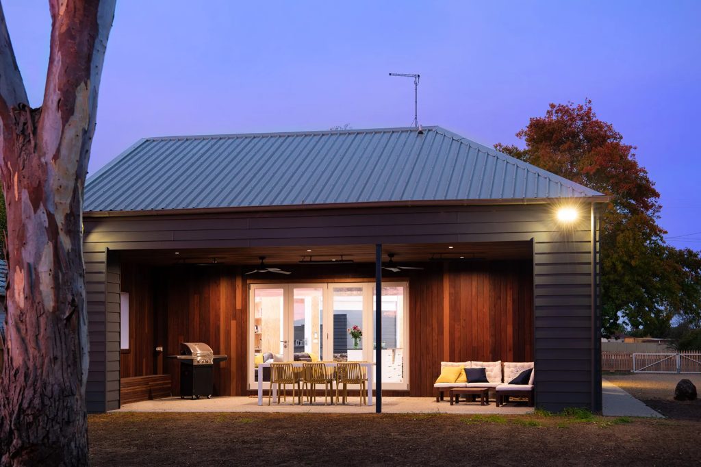 Modern outdoor dining area at twilight
